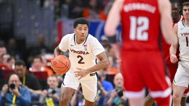 Reece Beekman handles the ball during the Virginia men's basketball game against NC State in the semifinals of the 2024 ACC Men's Basketball Tournament at Capital One Arena.
